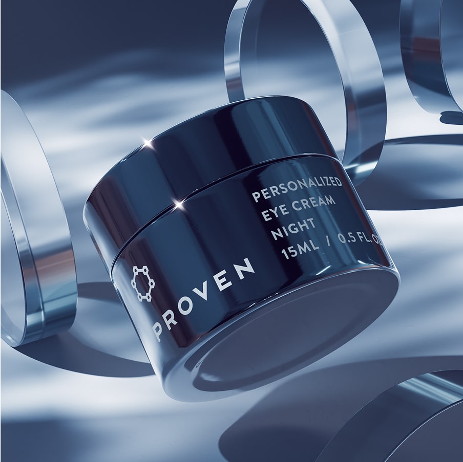 The Personalized Eye Cream Night jar, 15 ml, in deep blue among curved glass forms.