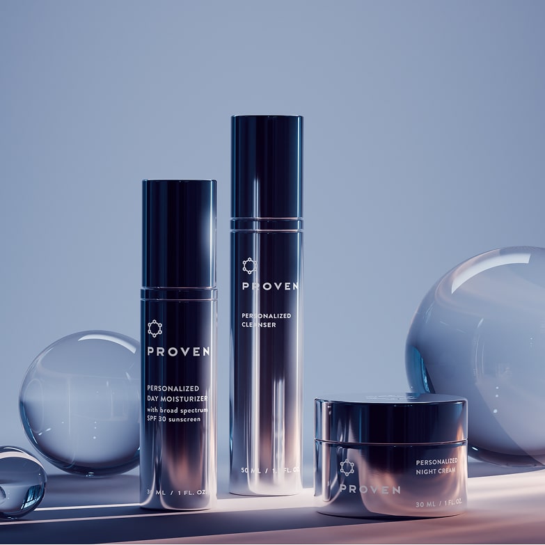 The three PROVEN products together on a pale blue set: the Personalized Day Moisturizer with broad-spectrum SPF 30, the Personalized Cleanser, and the Personalized Night Cream.