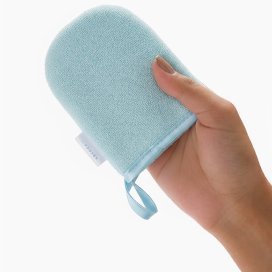A hand wearing the mitt, showing it sized to fit over the palm.