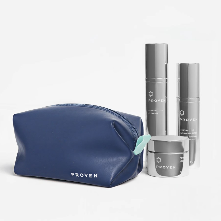 The navy bag beside a full PROVEN routine — cleanser, day moisturizer, serum and night cream — showing how much it holds.