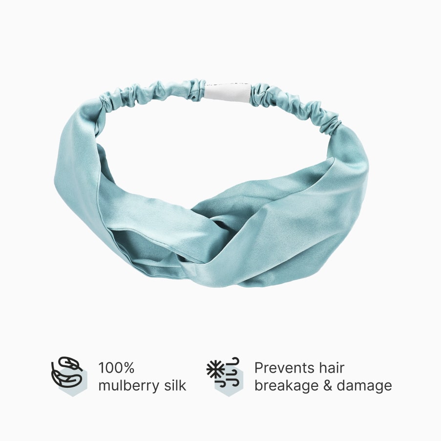 The pale-blue silk headband with a twisted front and elasticated back, above two claims: 100% mulberry silk, prevents hair breakage and damage.