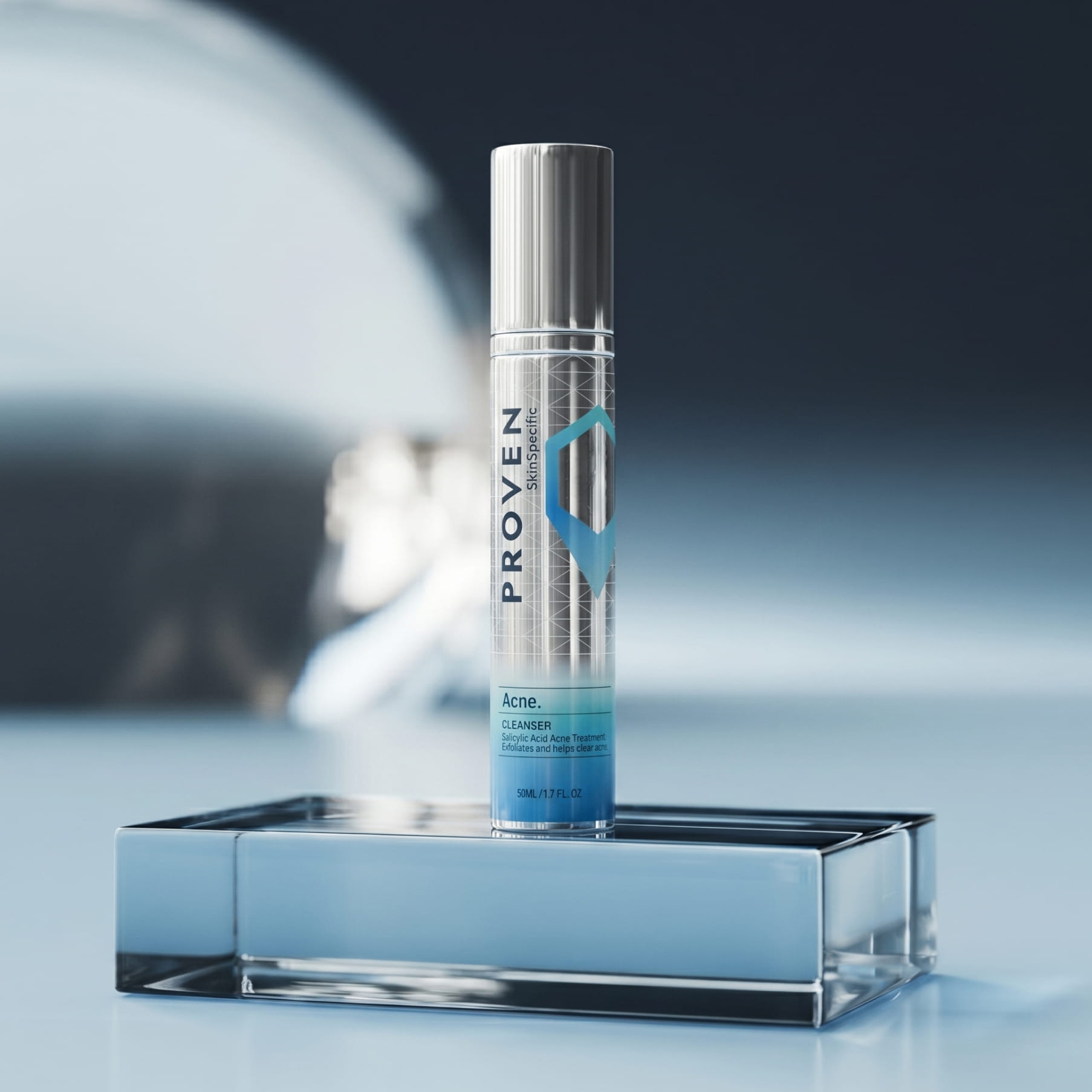The SkinSpecific Acne Treatment Cleanser bottle, silver with a blue label, on a blue glass block