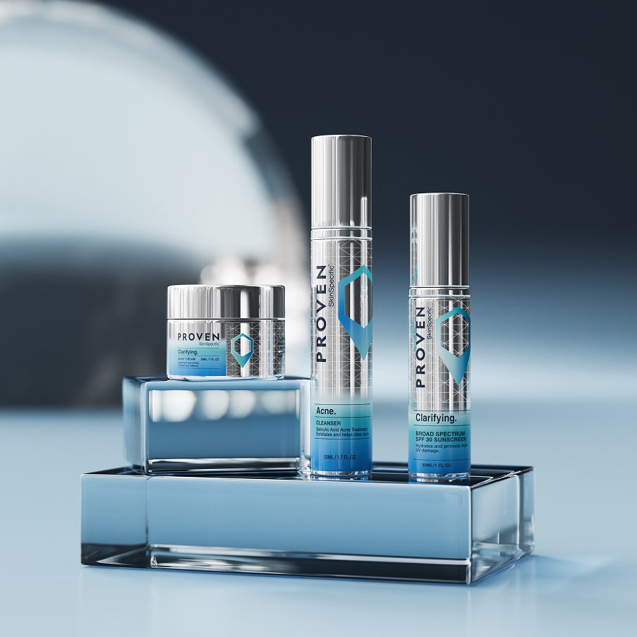 The three SkinSpecific Acne and Clarifying products — night cream, cleanser and sunscreen — on blue glass blocks