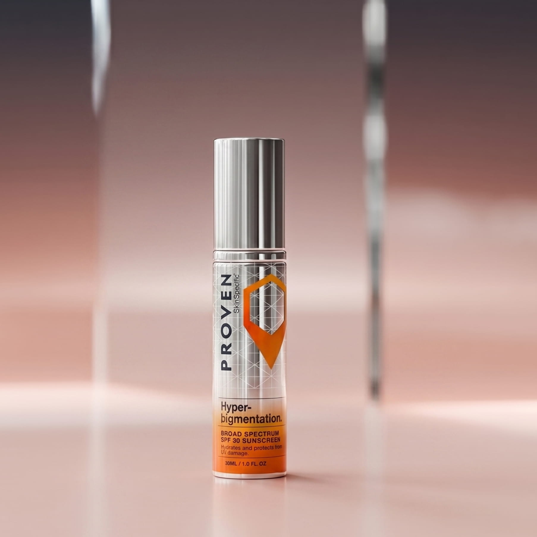 The SkinSpecific Hyperpigmentation Broad Spectrum SPF 30 Sunscreen bottle, silver with an orange label, on a pink backdrop